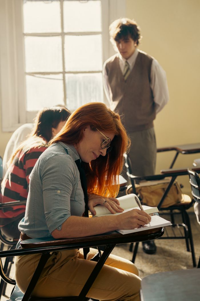 Focused students in a university classroom environment during an educational session.